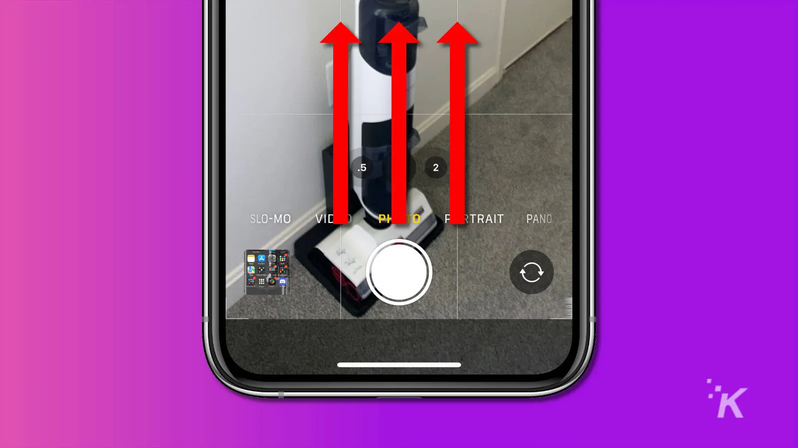 Captura de pantalla de la cámara del iPhone que muestra el botón del obturador deslizante para acceder a la configuración