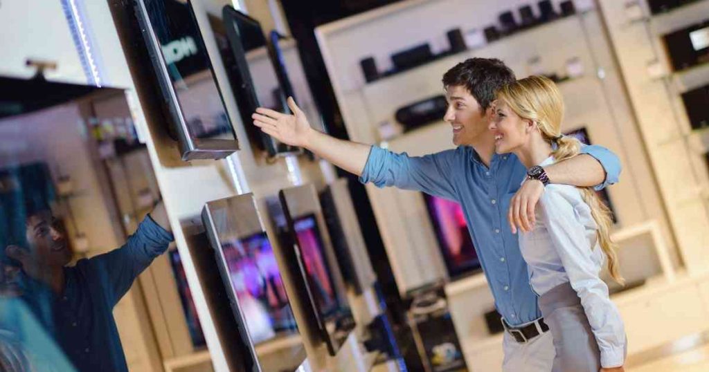 couple choosing a television